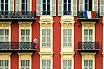 House In Nice With French Flag On A Balcony